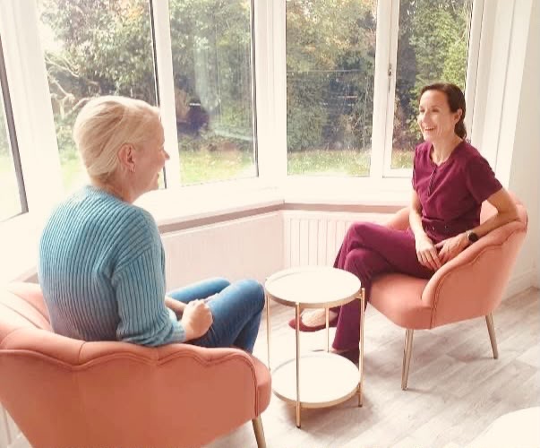 Dr. Charlotte consulting with a patient in the clinic